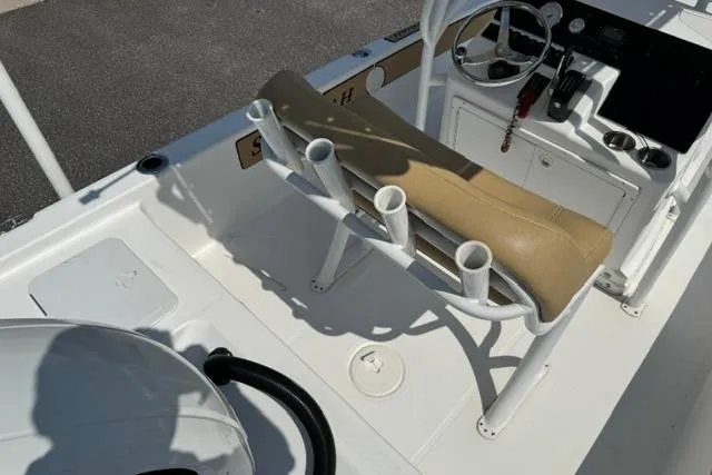 Slide: The Image of 2022 Savannah 190 IS boat interior with steering console and rod holders. - 11