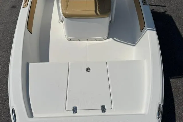 Slide: The Image of 2022 Savannah 190 IS boat deck with tan seating and storage compartments. - 8