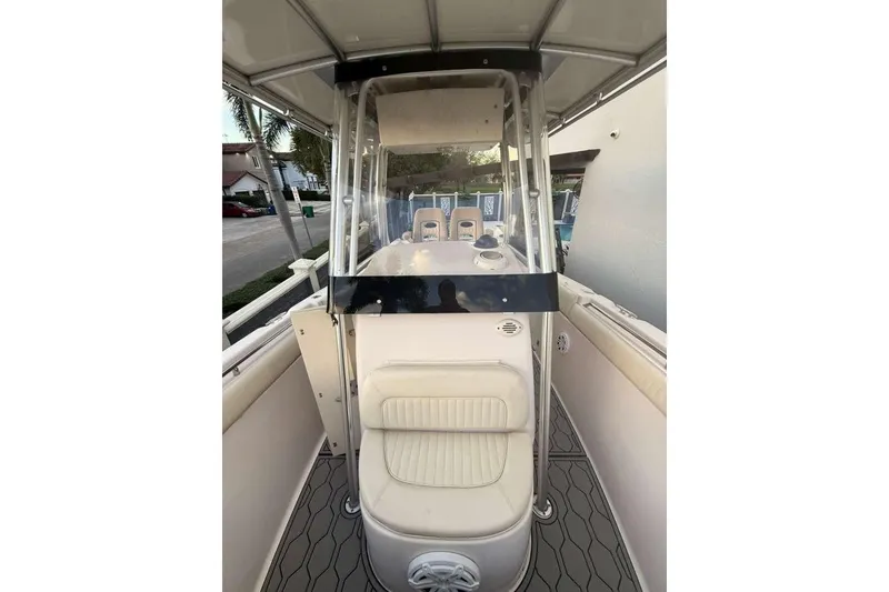 Slide: The Image of 2004 Grady-White Chase 273 boat interior with seating and console, showcasing sleek design. - 5