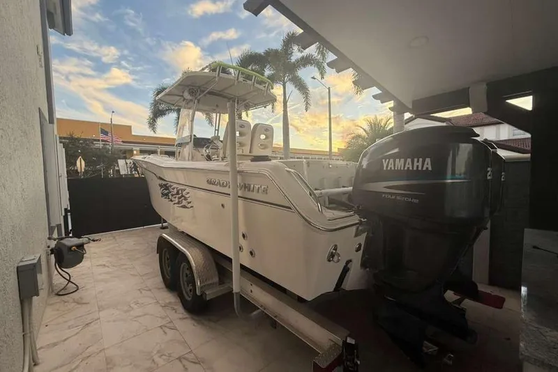 Slide: The Image of 2004 Grady-White Chase 273 boat with Yamaha engine on trailer at sunset. - 2