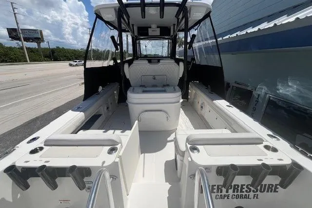 Slide: The Image of 2024 World Cat 295 CC boat interior with seating and rod holders, Cape Coral, FL. - 8