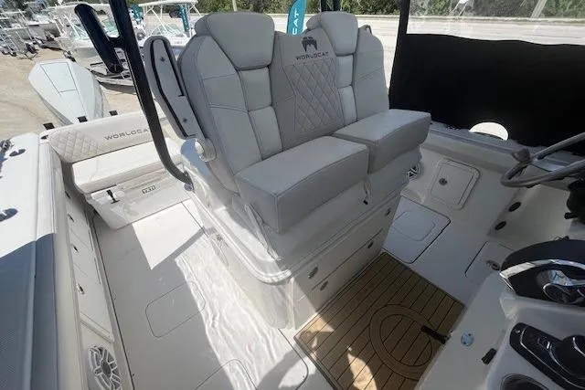 Slide: The Image of 2024 World Cat 295 CC boat interior with plush seating and modern controls. - 6
