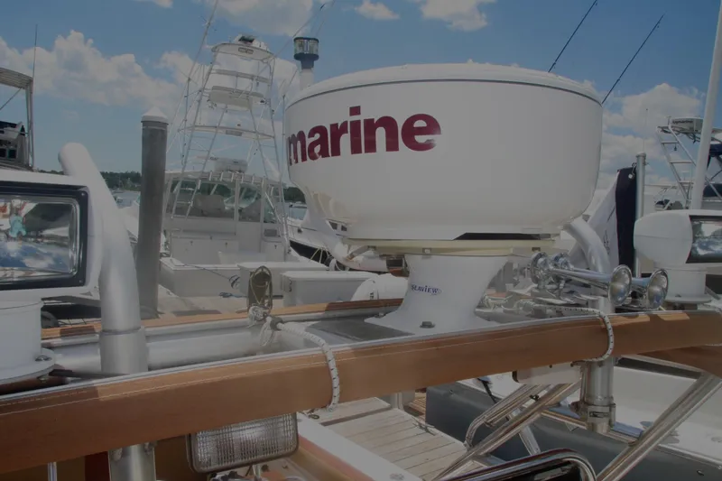 Slide: The Image of Radar equipment on a 1996 Marlago 35 boat docked at a marina. - 6