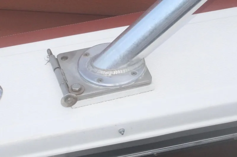 Slide: The Image of Close-up of a Marlago 35 boat hinge and metal fitting, 1996 model. - 4