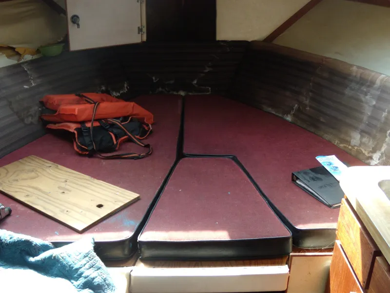 Slide: The Image of Interior of a 1973 Trojan F-32 with red cushions and storage space. - 8