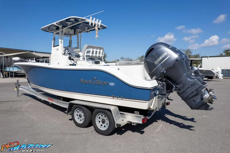 Slide: The Image of 2021 NauticStar 2602 Legacy boat on trailer with Yamaha outboard motor. - 35