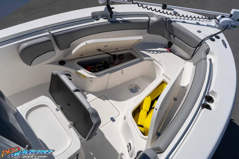 Slide: The Image of 2021 NauticStar 2602 Legacy boat interior with open storage compartments and seating. - 29