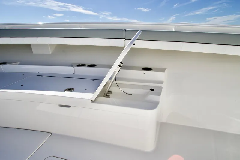 Slide: The Image of Open storage compartment on 2027 Regulator 41 boat under clear blue sky. - 8