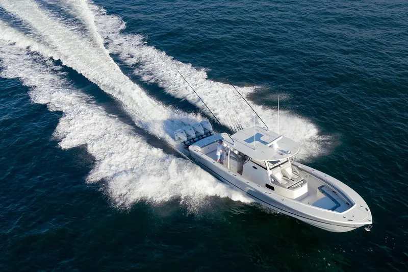 The Image of 2027 Regulator 41 boat cruising on open water, leaving a wake behind. - 0