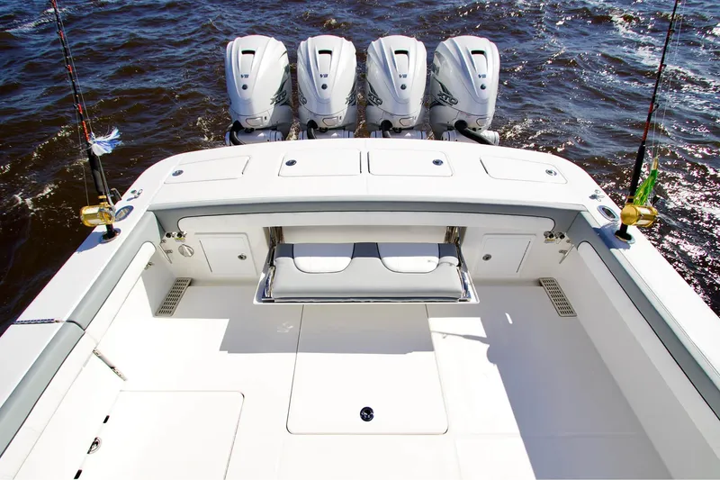 Slide: The Image of 2027 Regulator 41 boat with quad V8 engines on open water. - 2