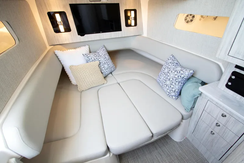 Slide: The Image of Luxurious interior of 2027 Regulator 41 boat with plush seating and decorative pillows. - 12