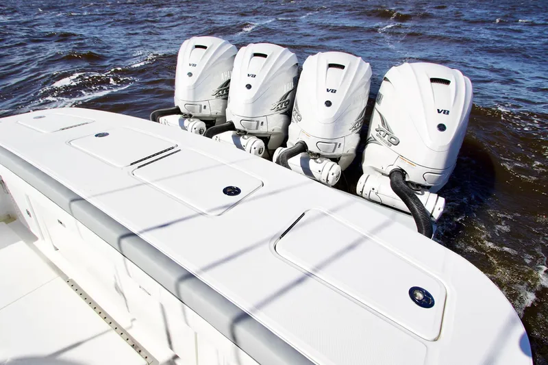 Slide: The Image of 2027 Regulator 41 boat with four powerful V8 engines on the water. - 4