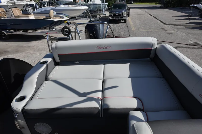 Slide: The Image of 2022 Barletta Corsa 23U boat interior with gray seating and cup holders. - 13