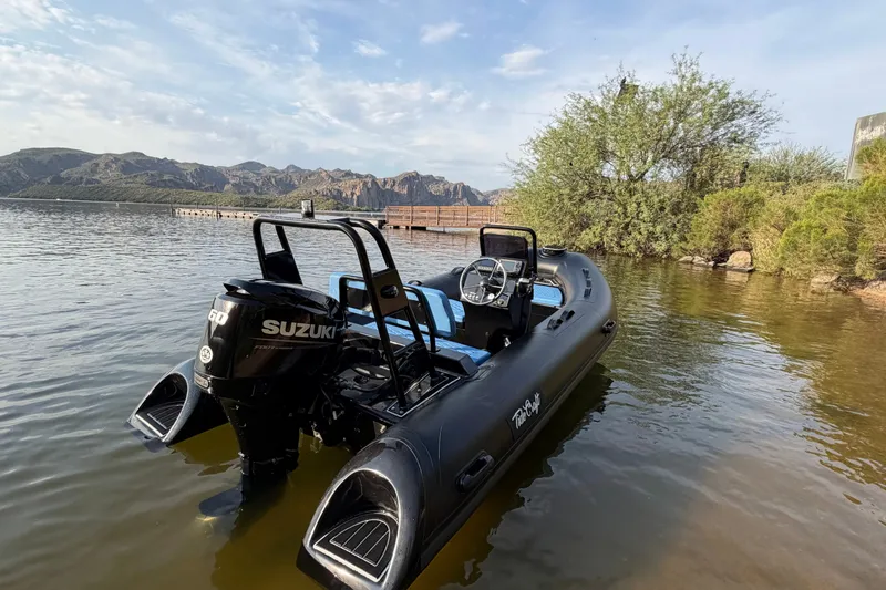 The Image of 2027 Tide Craft Custom Black and Blue Catalina 13 boat with Suzuki engine on a scenic lake. - 4