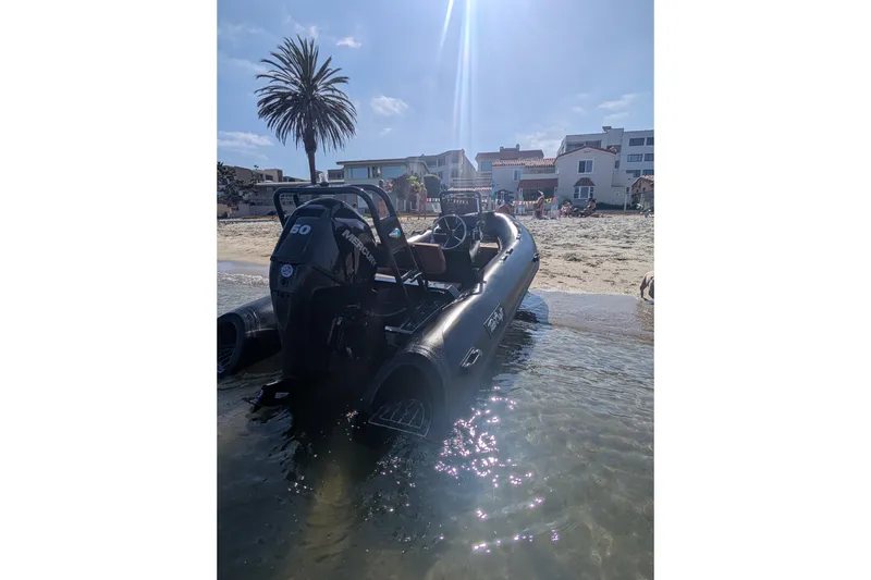 Slide: The Image of 2026 Tide Craft Custom Black & Tan Catalina 13 boat on sunny beach with palm tree. - 5