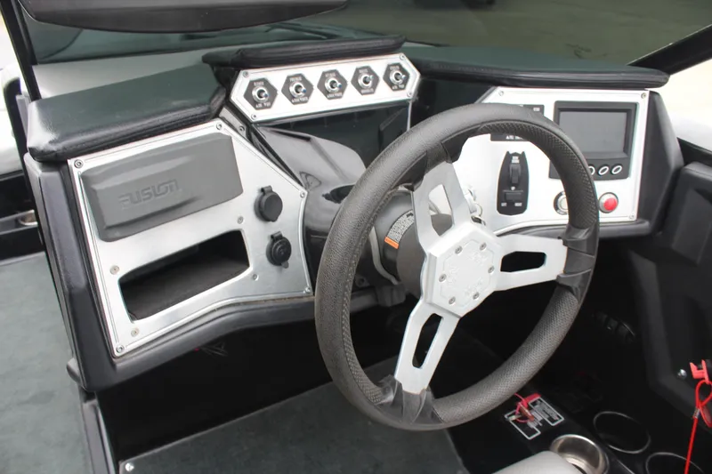 Slide: The Image of Steering console of a 2017 MasterCraft NXT22 boat with modern controls and dashboard. - 25