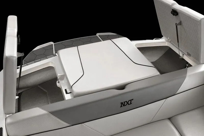 Slide: The Image of Manufacturer Provided Image: 2017 MasterCraft NXT22 boat interior with open storage compartments. - 6