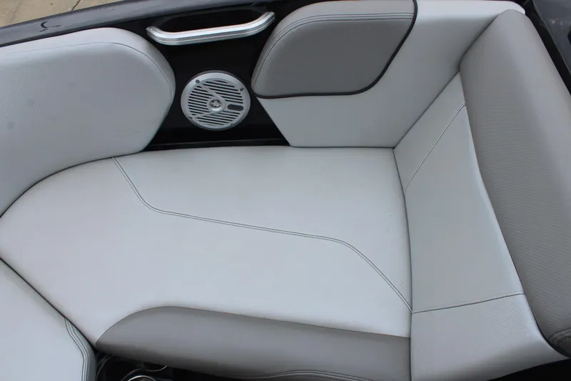 Slide: The Image of 2017 MasterCraft NXT22 boat interior with white cushioned seating and speaker. - 34