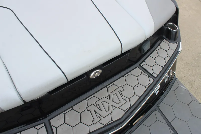 Slide: The Image of 2017 MasterCraft NXT22 boat with hexagonal deck design and white seating. - 13