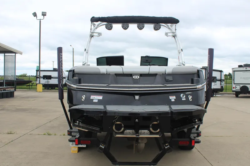 Slide: The Image of 2017 MasterCraft NXT22 boat rear view, showcasing sleek design and modern features. - 7