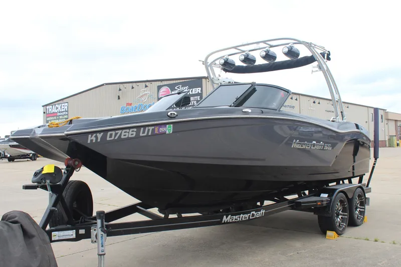 Slide: The Image of 2017 MasterCraft NXT22 boat on trailer, parked outside dealership. - 4