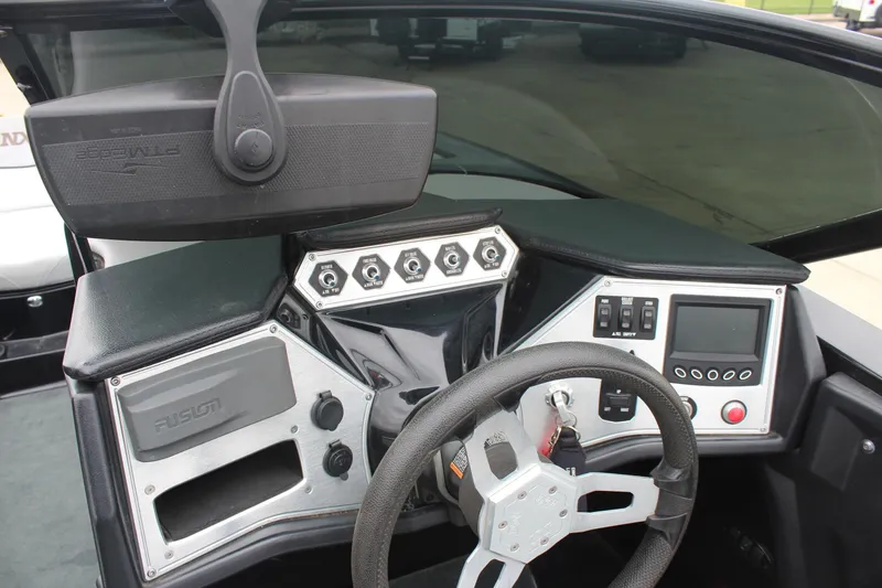 Slide: The Image of 2017 MasterCraft NXT22 dashboard with steering wheel, controls, and display panel. - 26