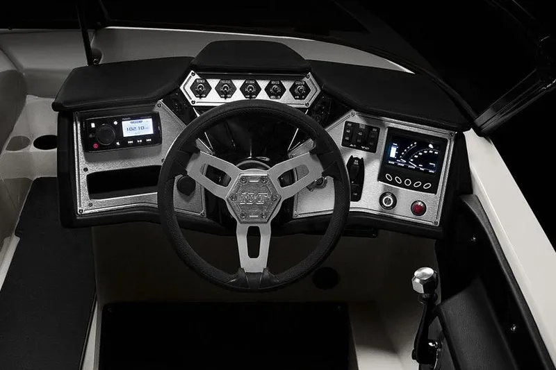 Slide: The Image of Manufacturer Provided Image: 2017 MasterCraft NXT22 boat dashboard with steering wheel and control panel. - 1
