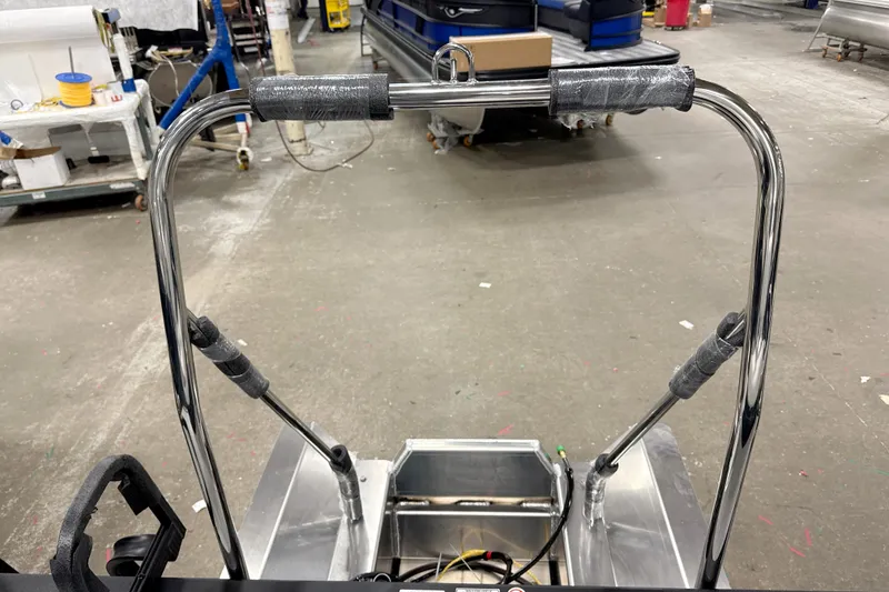 Slide: The Image of 2026 Bennington 22 S-One Swingback boat frame in a workshop setting. - 16