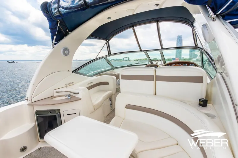 Slide: The Image of 2004 Sea Ray Sundancer 320 interior with seating, table, and ocean view. - 36