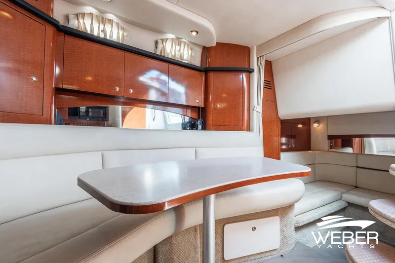 Slide: The Image of Luxurious interior of 2004 Sea Ray Sundancer 320 yacht with elegant seating and cabinetry. - 11