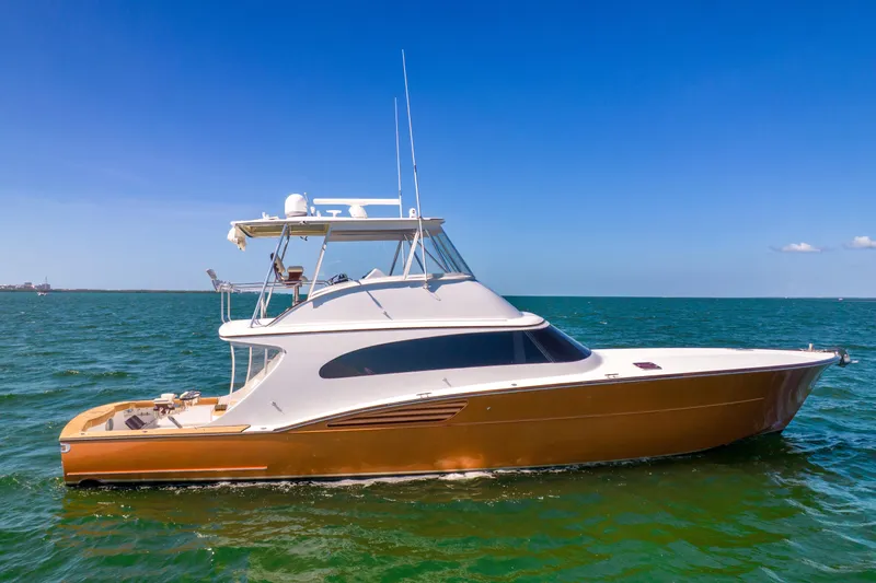 Slide: The Image of Garlington Convertible 2022: Sleek yacht with modern design, on calm waters under a clear sky. - 7