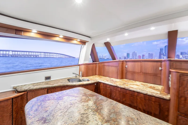 Slide: The Image of The luxurious interior of a 2022 Garlington Convertible with granite surfaces and panoramic windows. - 41