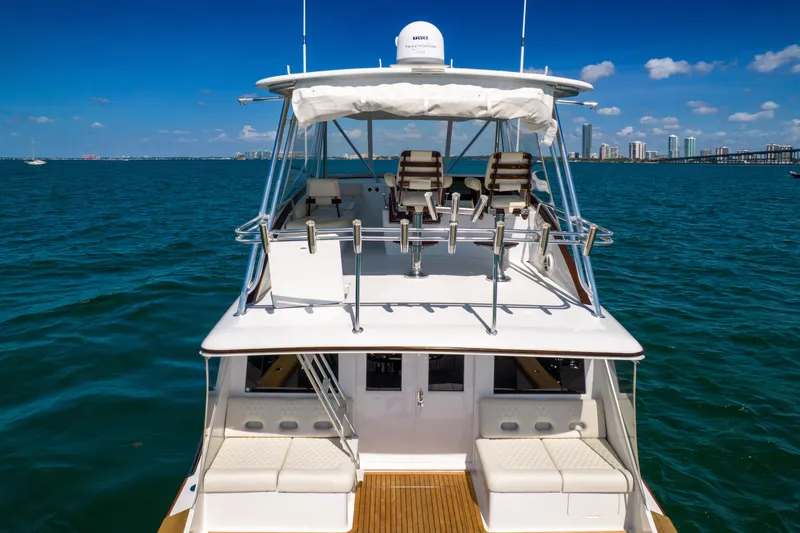 Slide: The Image of A luxurious 2022 Garlington Convertible boat on open water with a spacious flybridge. - 23