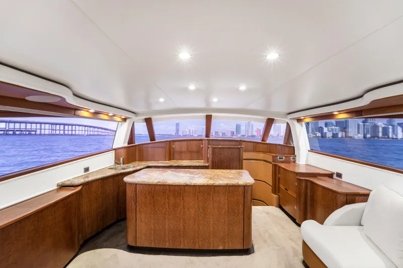 Slide: The Image of Interior of a luxury yacht with wooden furnishings and panoramic windows overlooking a city and the sea. - 39
