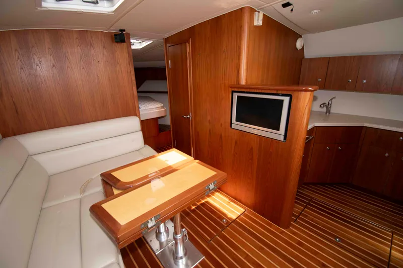 Slide: The Image of Luxurious interior of 2004 Tiara Yachts 4100 Open with wood finish and modern amenities. - 22