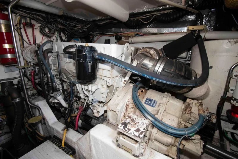Slide: The Image of Engine room of a 2004 Tiara Yachts 4100 Open, showcasing mechanical components and wiring. - 28