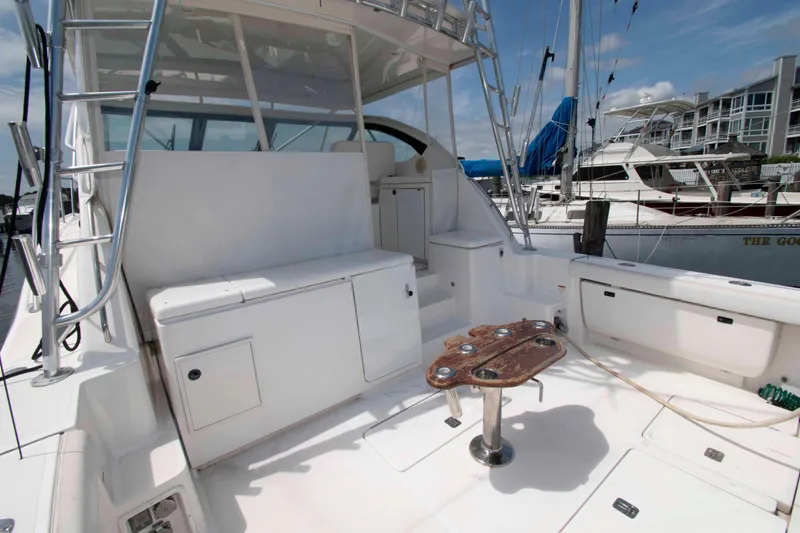 Slide: The Image of 2004 Tiara Yachts 4100 Open cockpit with seating and fishing rod holders. - 4