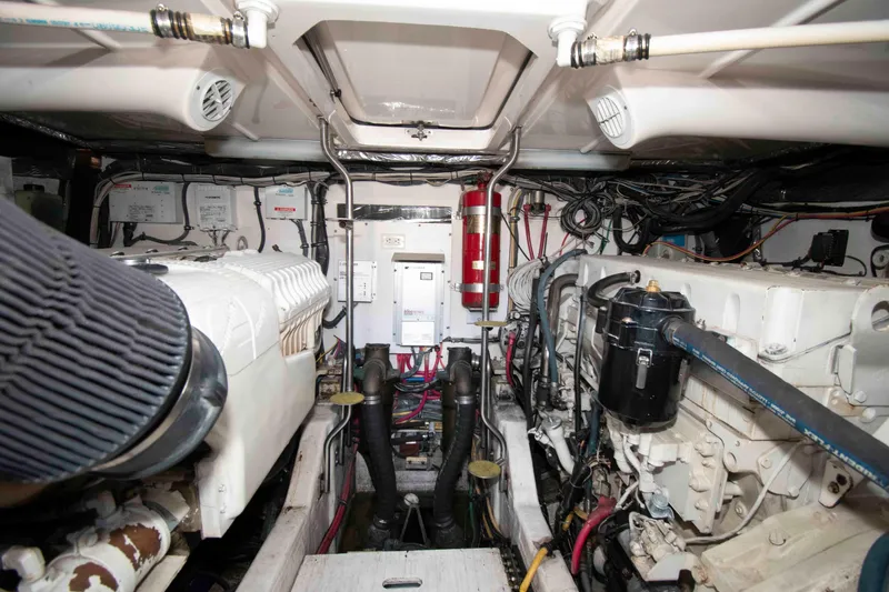 Slide: The Image of Engine room of a 2004 Tiara Yachts 4100 Open, showcasing mechanical components and wiring. - 27