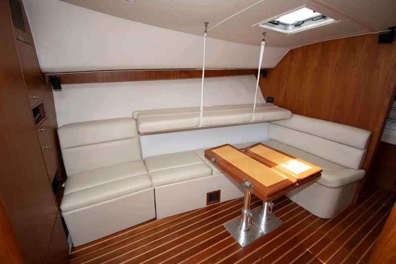 Slide: The Image of Luxurious interior of 2004 Tiara Yachts 4100 Open with elegant seating and wooden accents. - 23