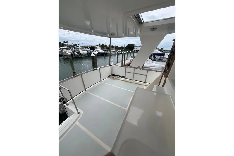 Slide: The Image of 2007 Heritage East 36 Sundeck Trawler, spacious deck view at marina. - 9