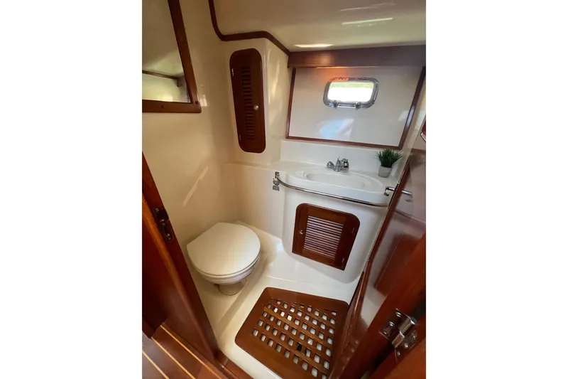 Slide: The Image of Bathroom interior of 2007 Heritage East 36 Sundeck Trawler with wooden accents. - 27