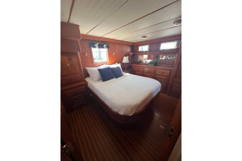 Slide: The Image of Luxurious bedroom interior of 2007 Heritage East 36 Sundeck Trawler with wood finish. - 18