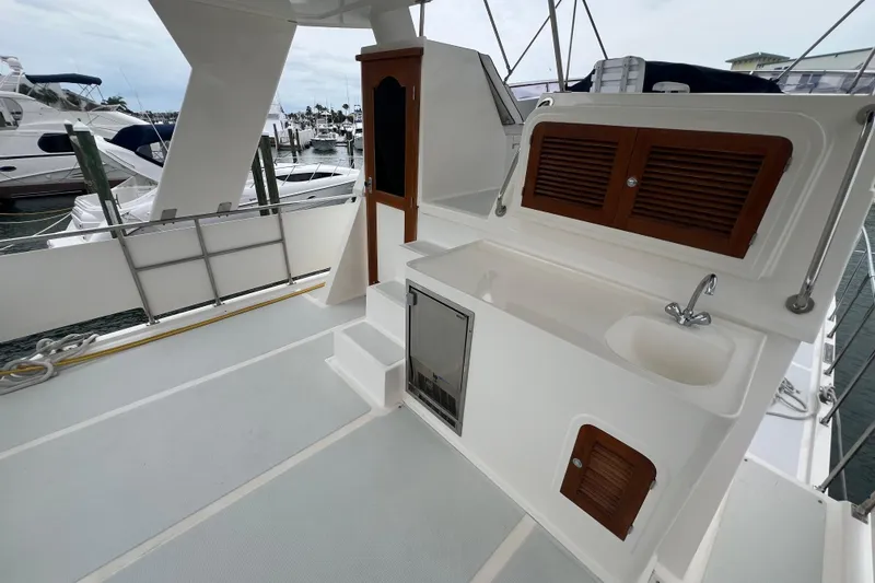 Slide: The Image of 2007 Heritage East 36 Sundeck Trawler with outdoor sink and storage on deck. - 5