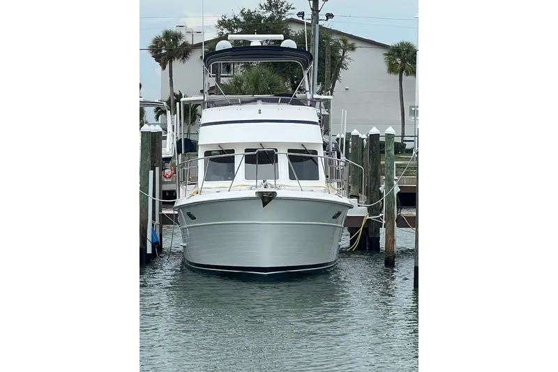 Slide: The Image of 2007 Heritage East 36 Sundeck Trawler docked at marina, front view. - 34