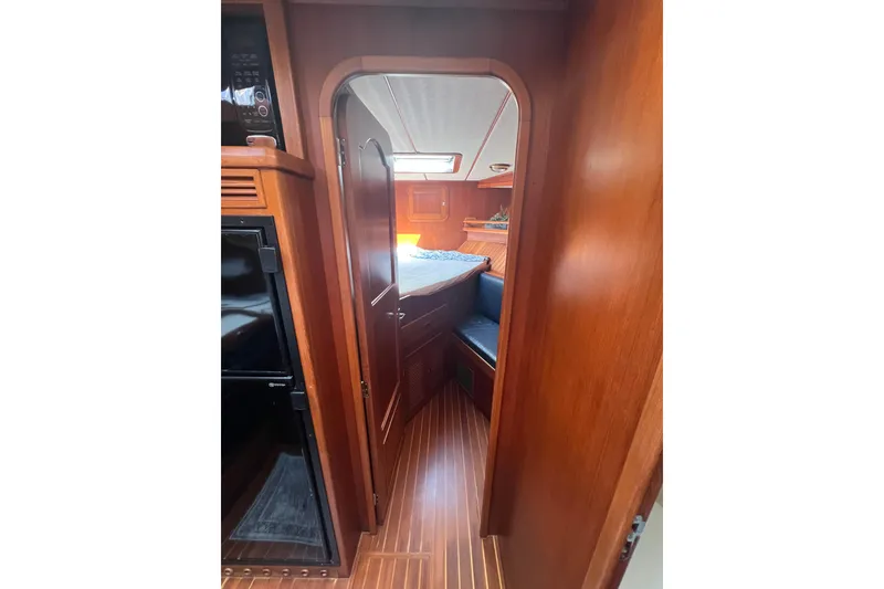 Slide: The Image of Interior of 2007 Heritage East 36 Sundeck Trawler with wood finish and cozy cabin. - 25