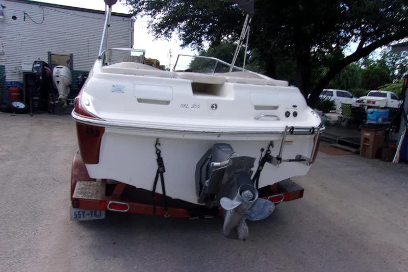 Slide: The Image of 2006 Glastron GXL 205 boat on trailer, rear view, parked outdoors. - 3