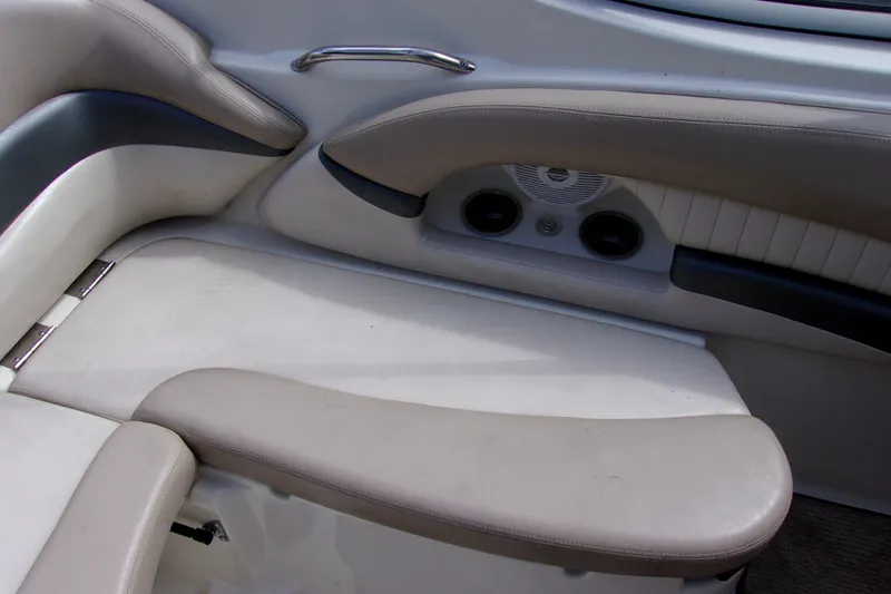 Slide: The Image of 2006 Glastron GXL 205 boat interior seating with cup holders and speaker. - 10