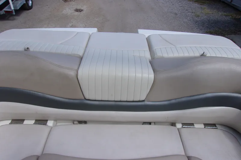 Slide: The Image of 2006 Glastron GXL 205 boat seating with white and gray upholstery. - 11
