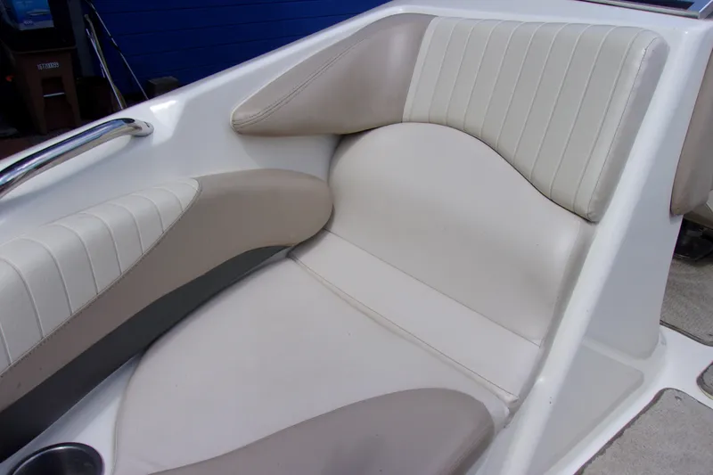 Slide: The Image of 2006 Glastron GXL 205 boat seat with beige and white upholstery. - 14
