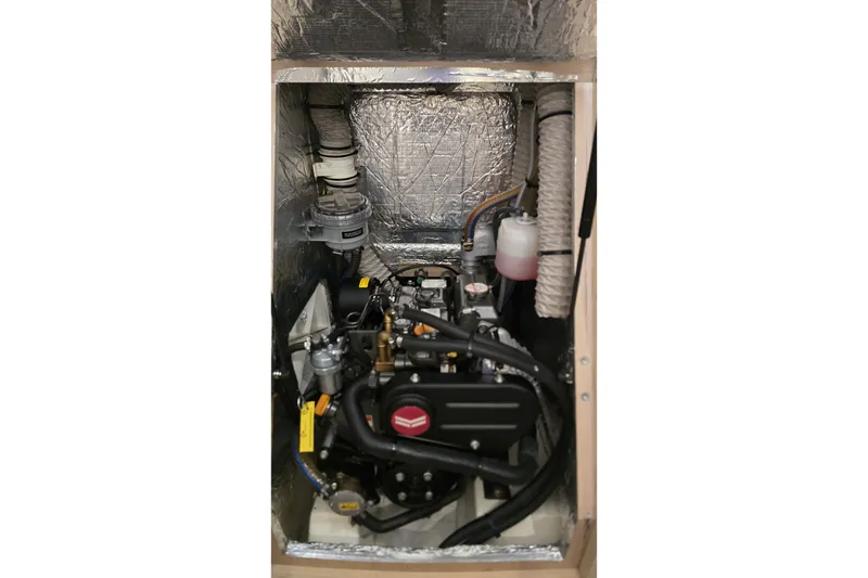 Slide: The Image of Engine compartment of a 2022 Beneteau Oceanis 30.1 sailboat, showcasing mechanical components. - 35